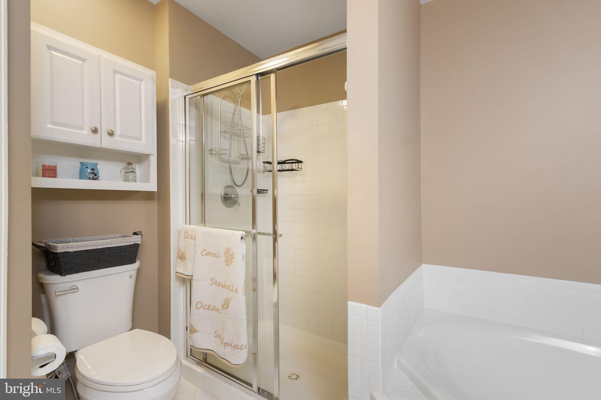 15636 Avocet Loop Woodbridge, VA 22191 - Photo 39 of 60 a white toilet sitting next to a bathroom sink