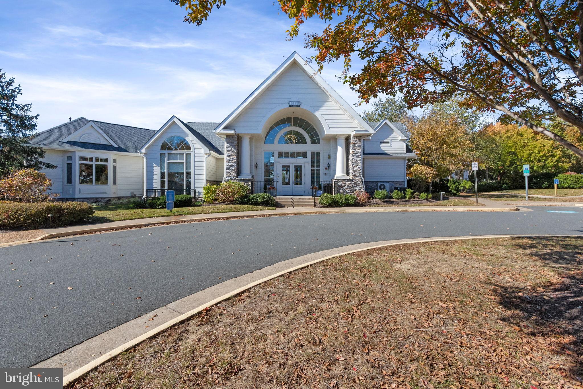 15636 Avocet Loop Woodbridge, VA 22191 - Photo 42 of 60 a front view of a house with a yard and outdoor seating
