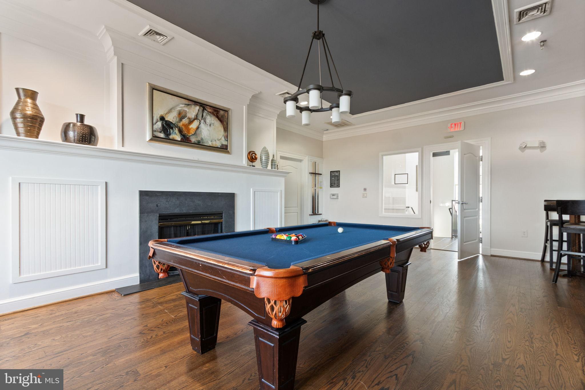 15636 Avocet Loop Woodbridge, VA 22191 - Photo 49 of 60 a room with wooden floor pool table and windows