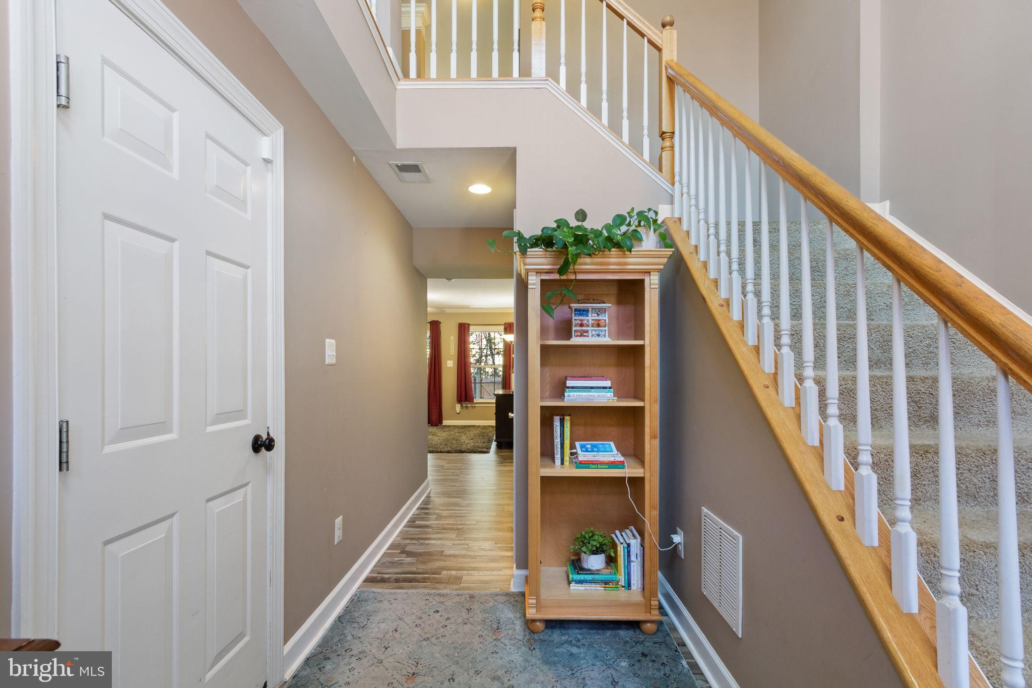 15636 Avocet Loop Woodbridge, VA 22191 - Photo 7 of 60 a view of entryway and hall with wooden floor