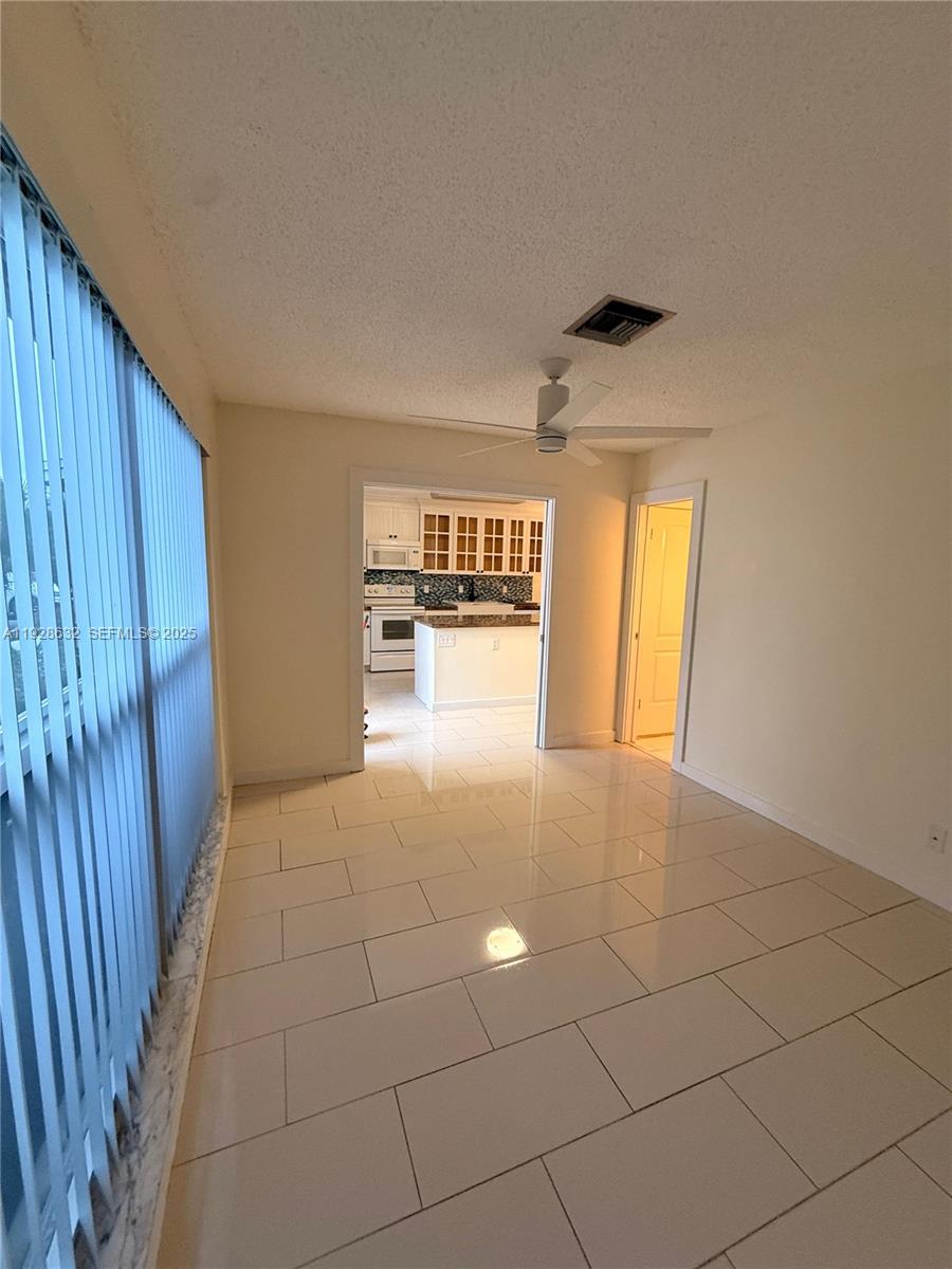 13741 Flora Place, Unit B Delray Beach, FL 33484 - Photo 11 of 50 a view of an empty room and window