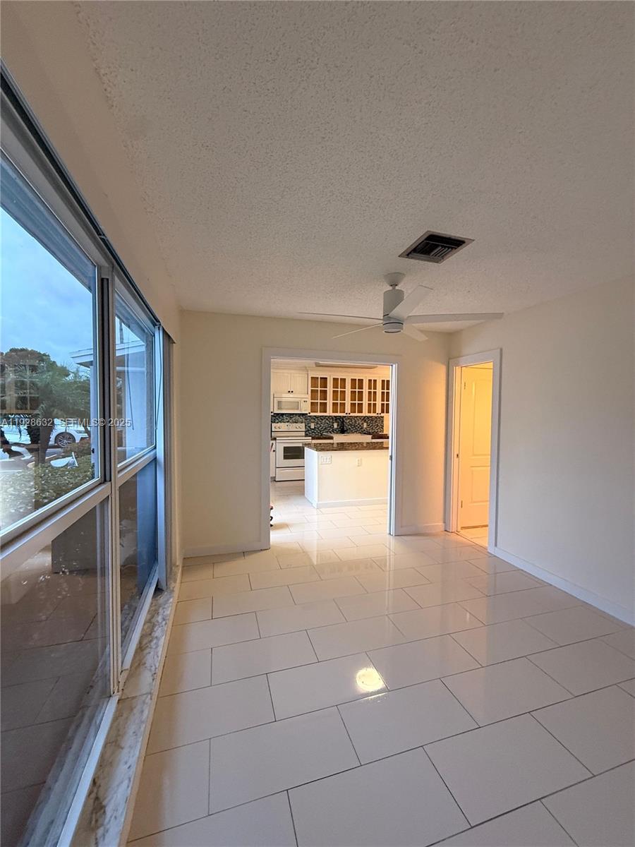 13741 Flora Place, Unit B Delray Beach, FL 33484 - Photo 15 of 50 a view of an empty room with a window