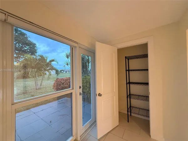 a view of a room with a large window