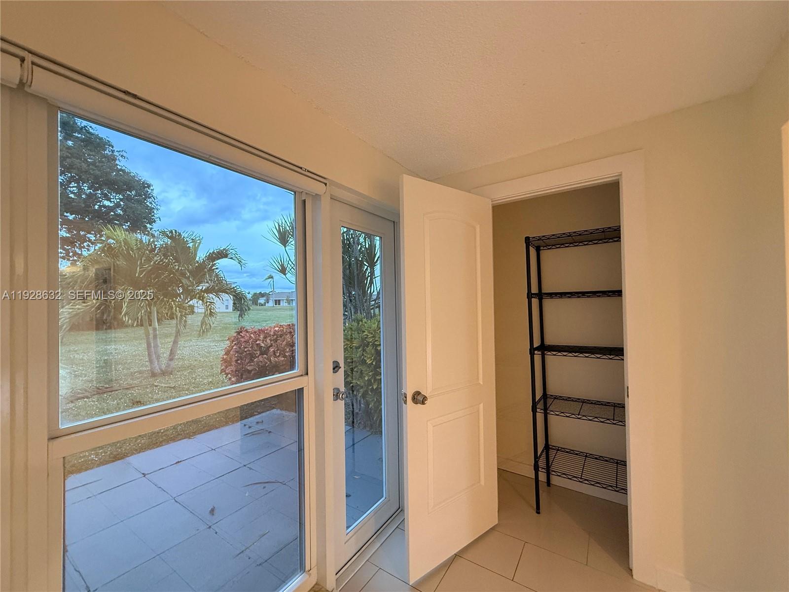 13741 Flora Place, Unit B Delray Beach, FL 33484 - Photo 16 of 50 a view of a room with a large window
