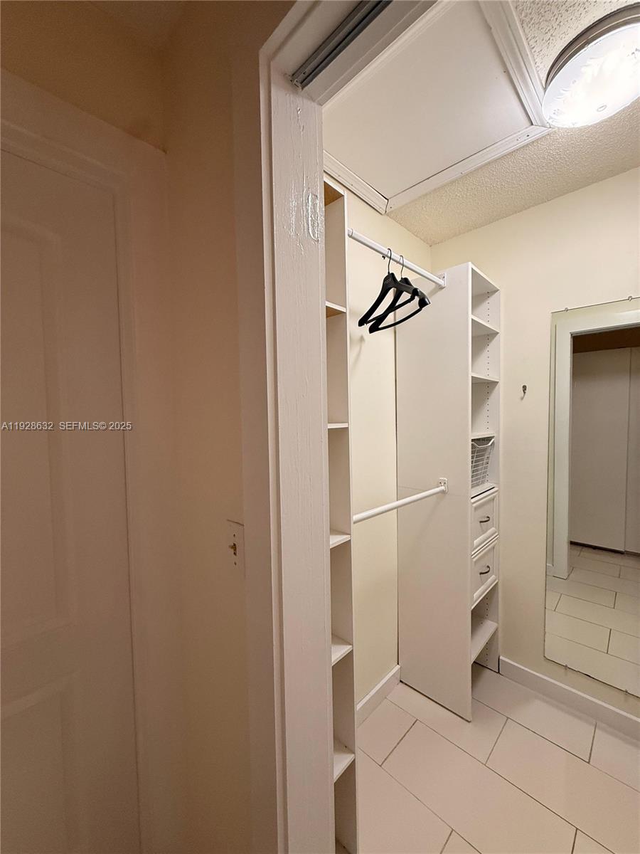 13741 Flora Place, Unit B Delray Beach, FL 33484 - Photo 20 of 50 a bathroom with a shower and a sink