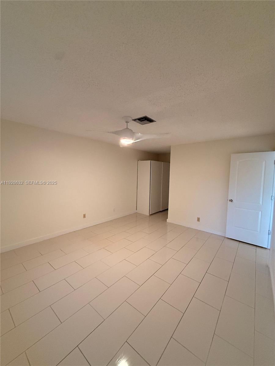 13741 Flora Place, Unit B Delray Beach, FL 33484 - Photo 25 of 50 a view of an empty room and a window