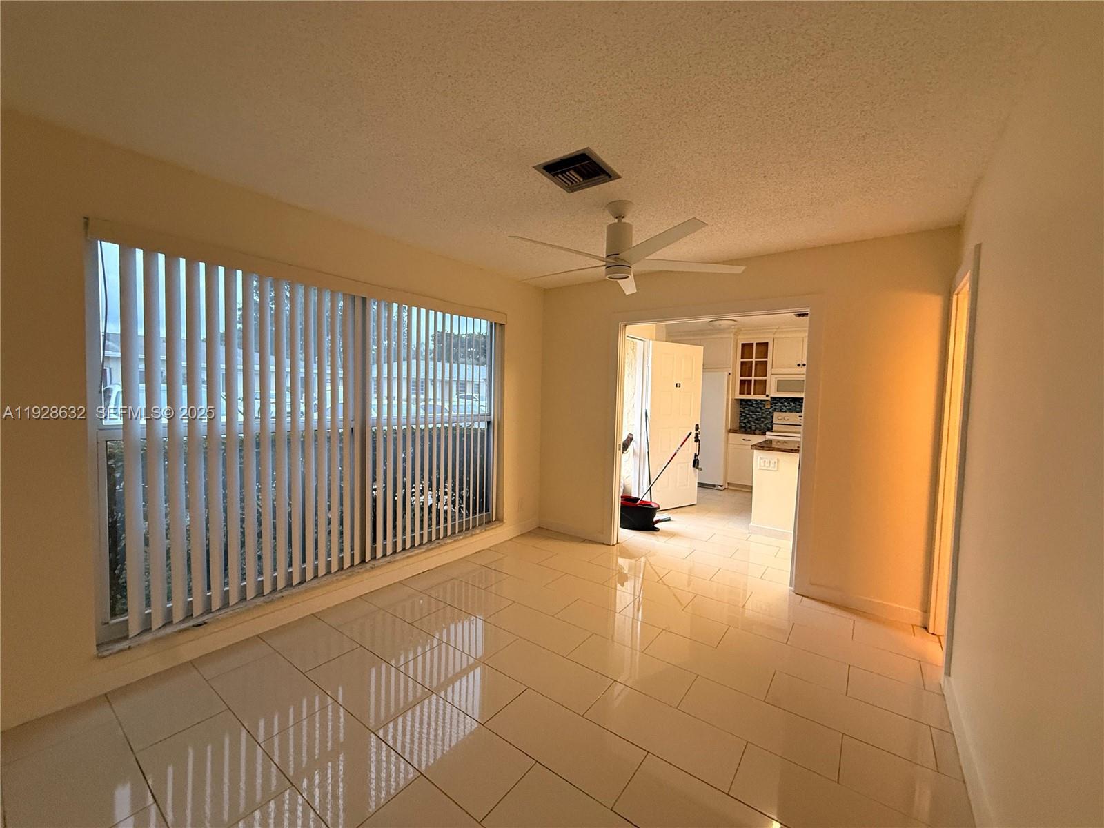 13741 Flora Place, Unit B Delray Beach, FL 33484 - Photo 26 of 50 a view of a livingroom with a hall and a window