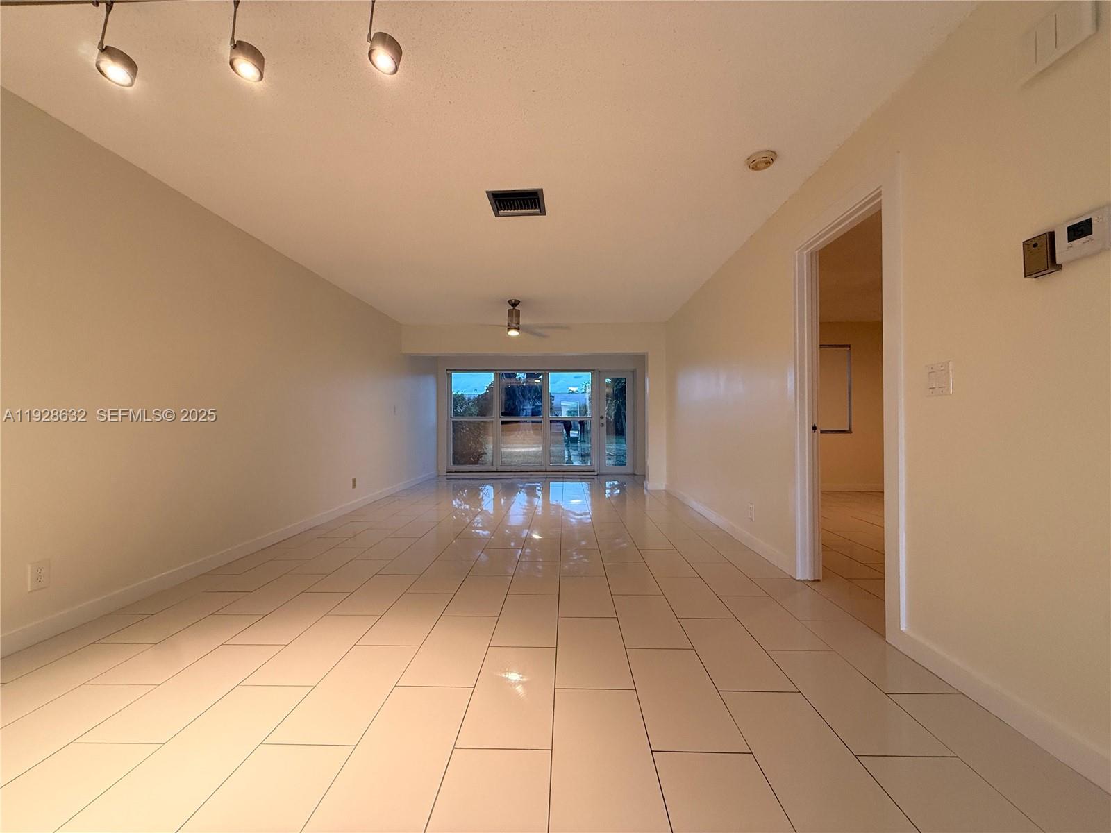 13741 Flora Place, Unit B Delray Beach, FL 33484 - Photo 29 of 50 a view of a hallway with seating area