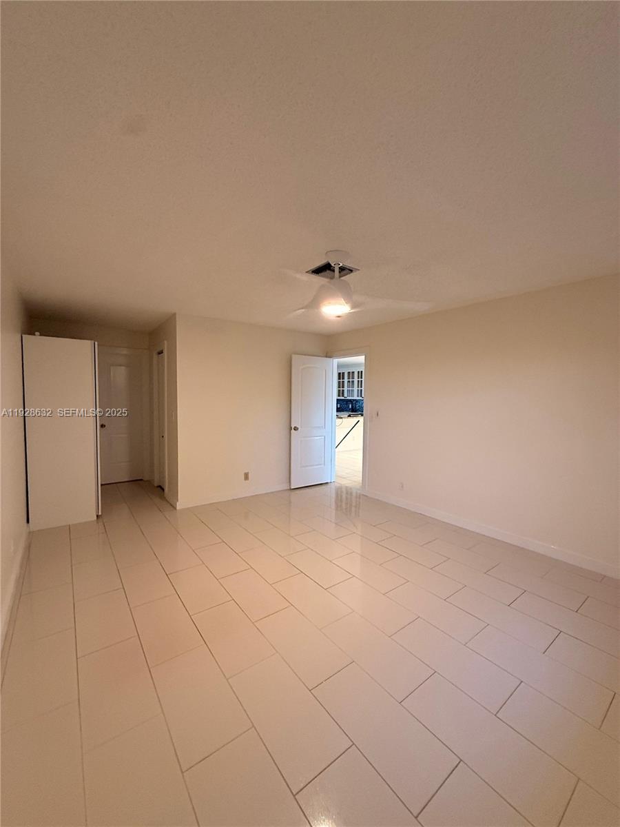 13741 Flora Place, Unit B Delray Beach, FL 33484 - Photo 32 of 50 a view of an empty room with a window