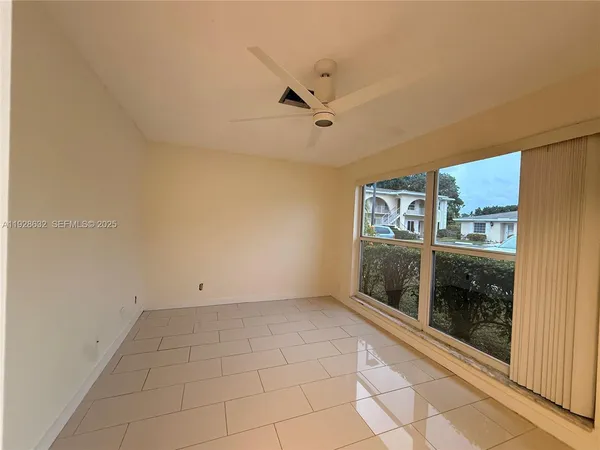a view of empty room with a fireplace
