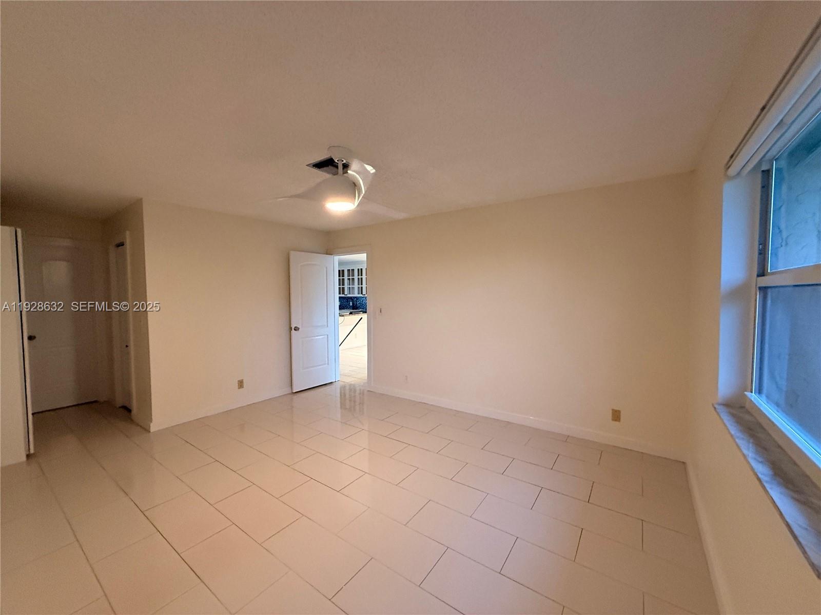 13741 Flora Place, Unit B Delray Beach, FL 33484 - Photo 35 of 50 wooden floor in an empty room with a window