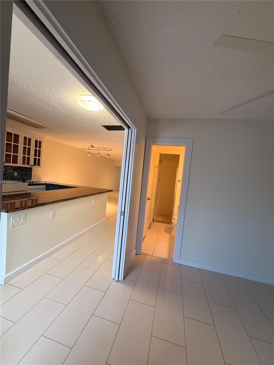 13741 Flora Place, Unit B Delray Beach, FL 33484 - Photo 37 of 50 a view of an empty room and a window