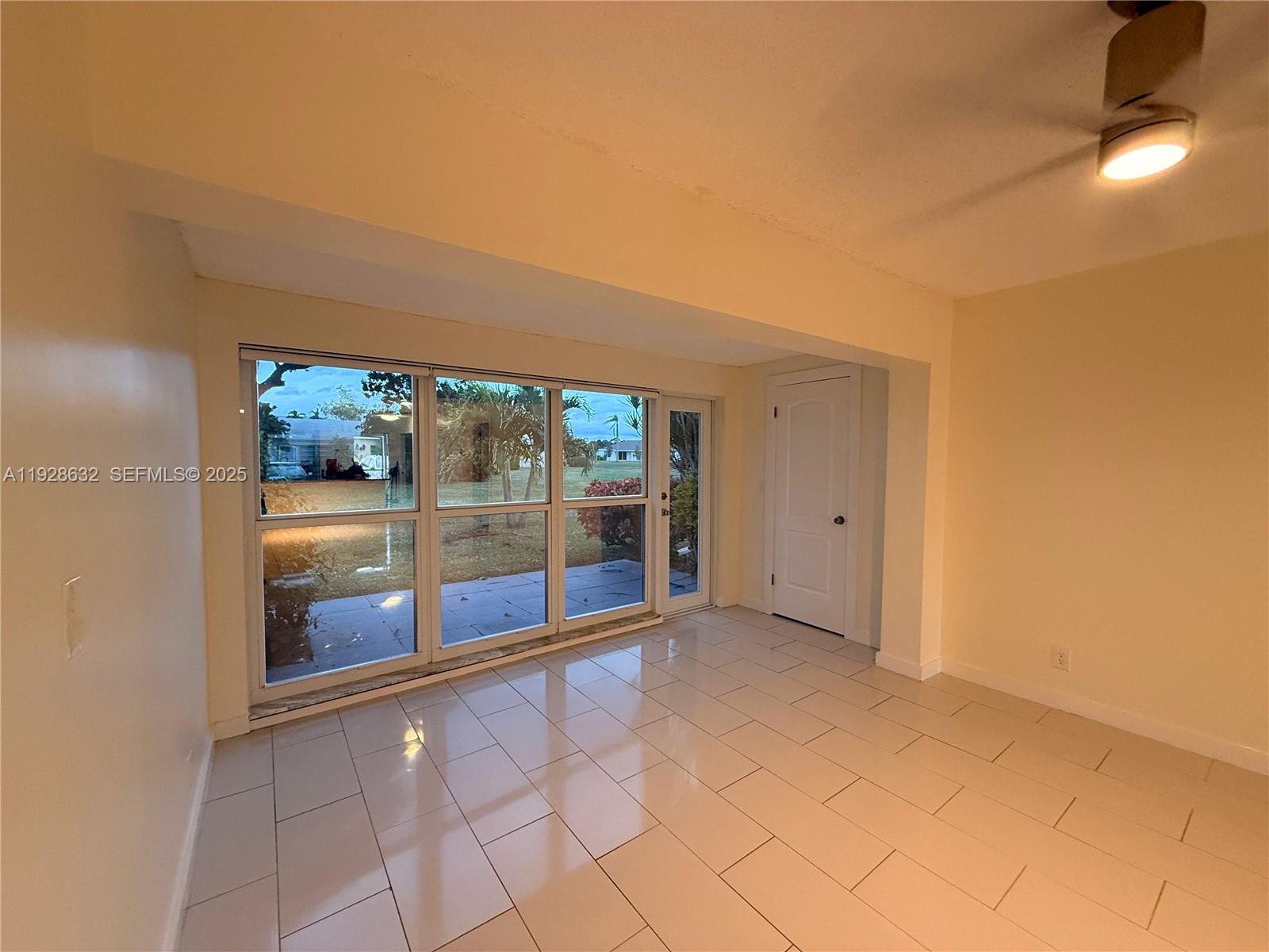 13741 Flora Place, Unit B Delray Beach, FL 33484 - Photo 45 of 50 a view of an empty room with a window