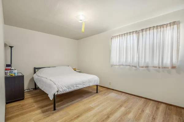a room with a bed and a window