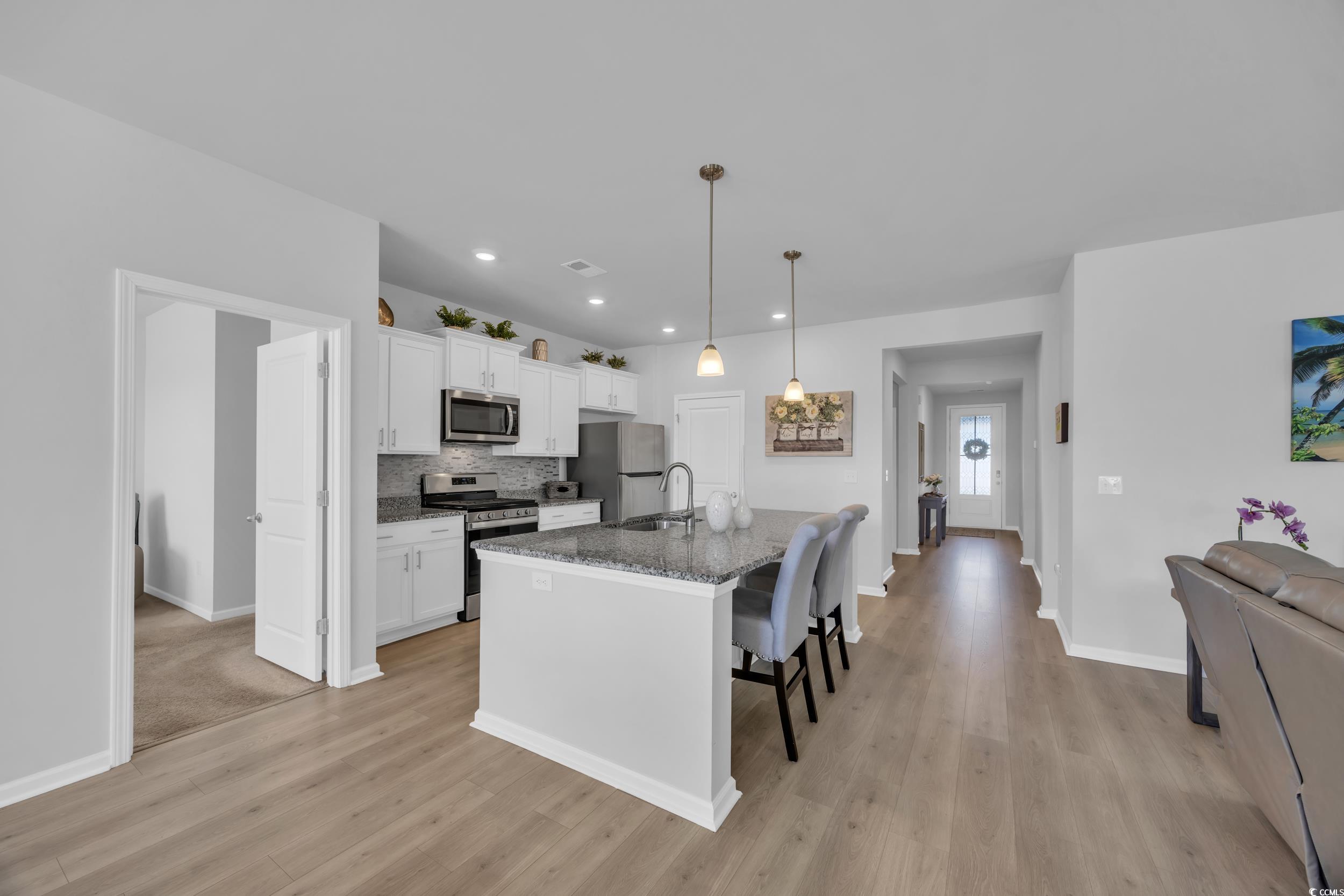 223 Juniata Loop Little River, SC 29566 - Photo 15 of 39 Kitchen featuring a breakfast bar, stainless steel