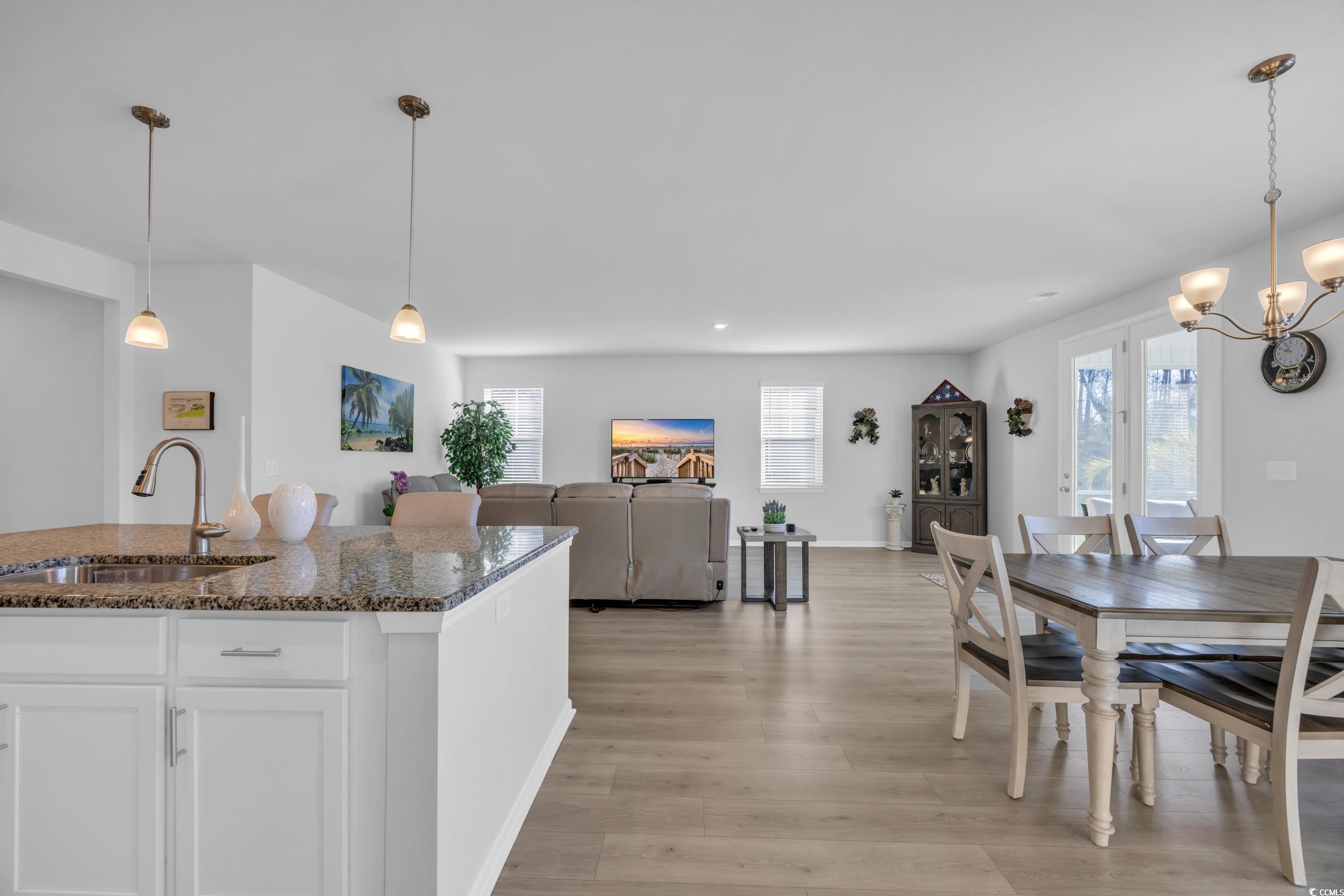 223 Juniata Loop Little River, SC 29566 - Photo 18 of 39 Dining area with light wood-style flooring, a nota