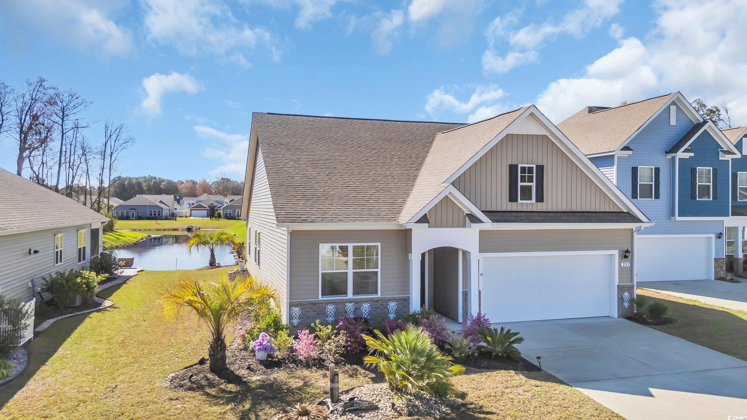 223 Juniata Loop Little River, SC 29566 - Photo 2 of 39 Craftsman-style house with concrete driveway, boar