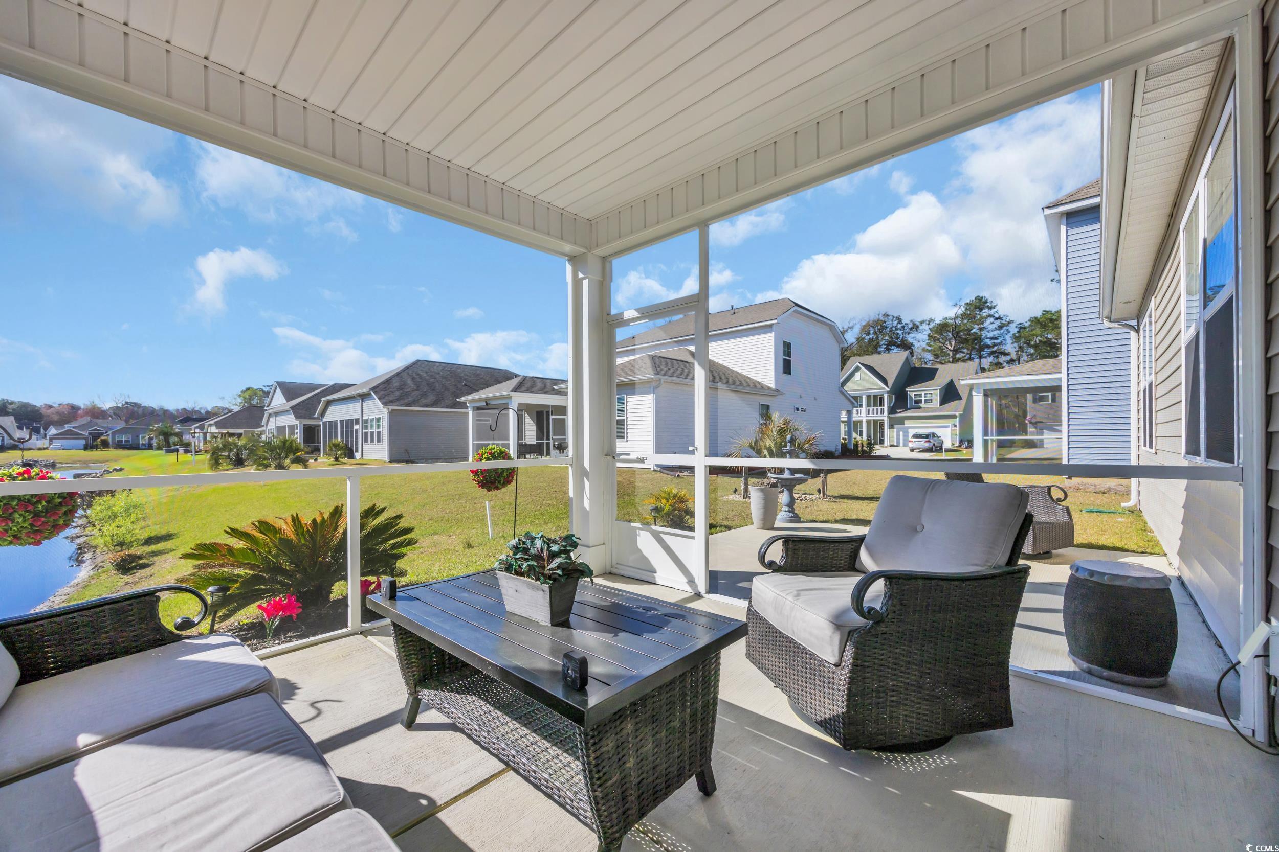 223 Juniata Loop Little River, SC 29566 - Photo 22 of 39 Sunroom / solarium featuring a residential view an