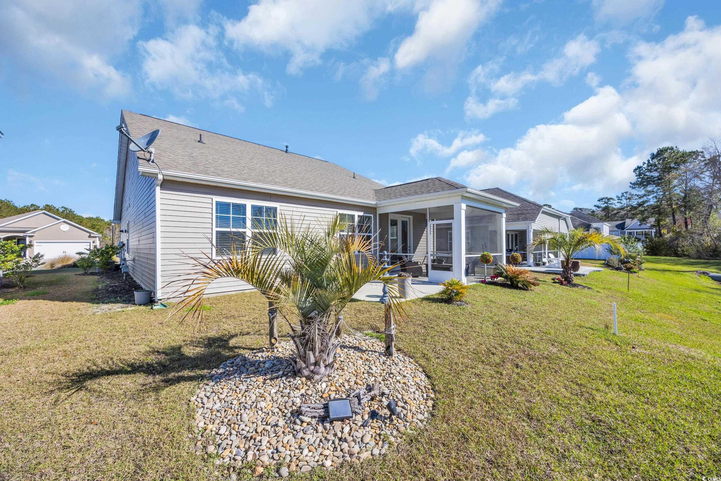 223 Juniata Loop Little River, SC 29566 - Photo 23 of 39 Rear view of property with a patio, a sunroom, a s