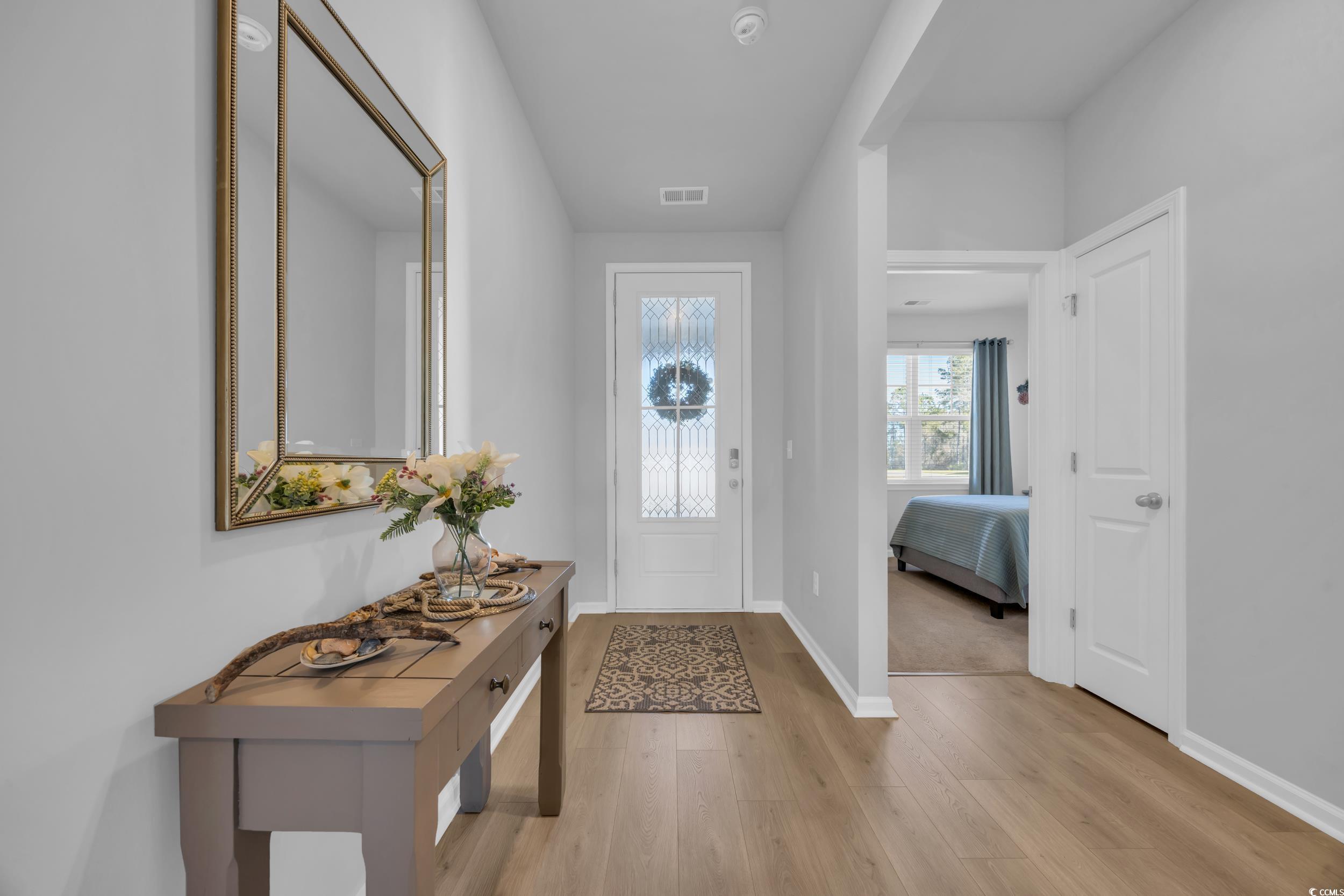 223 Juniata Loop Little River, SC 29566 - Photo 7 of 39 Foyer featuring baseboards, visible vents, and woo