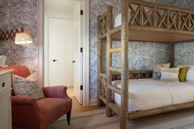 a bedroom with furniture and a window