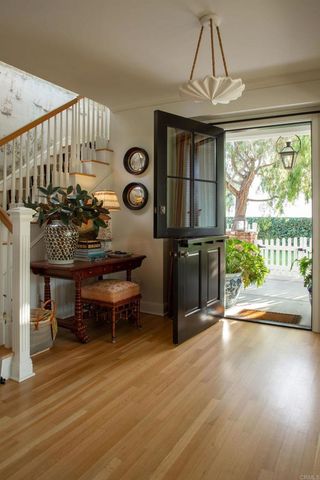 a view of a living room and a wooden floor