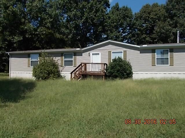 1973 South Commerce Road Watertown, TN 37184 - Photo 16 of 22 a front view of house with yard and green space