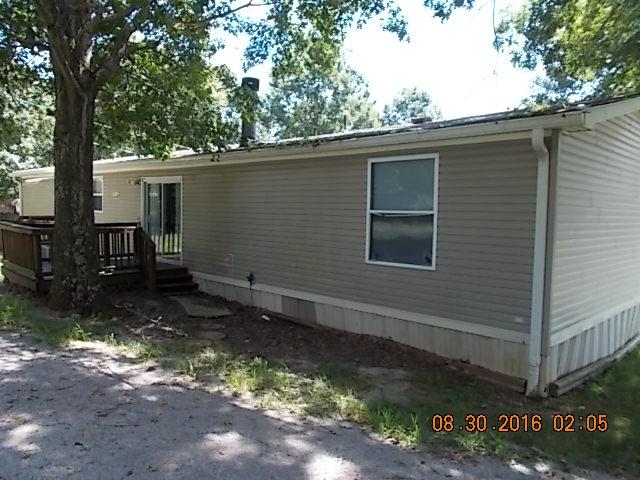 1973 South Commerce Road Watertown, TN 37184 - Photo 20 of 22 a backyard of a house with table and chairs