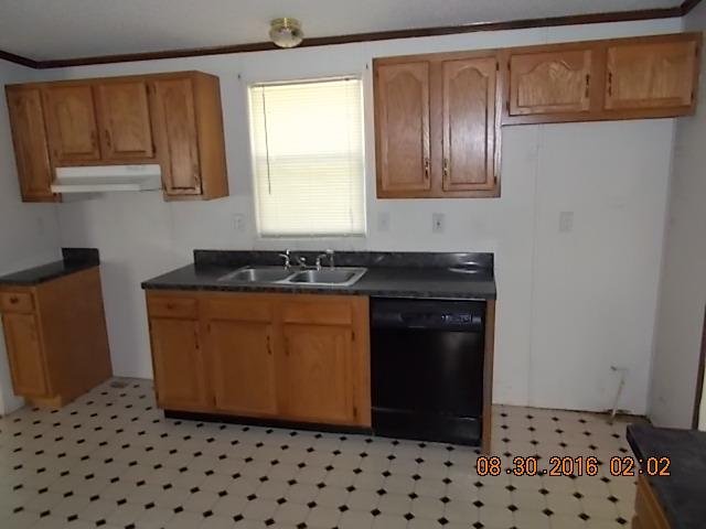 1973 South Commerce Road Watertown, TN 37184 - Photo 3 of 22 a kitchen with a sink a stove and refrigerator