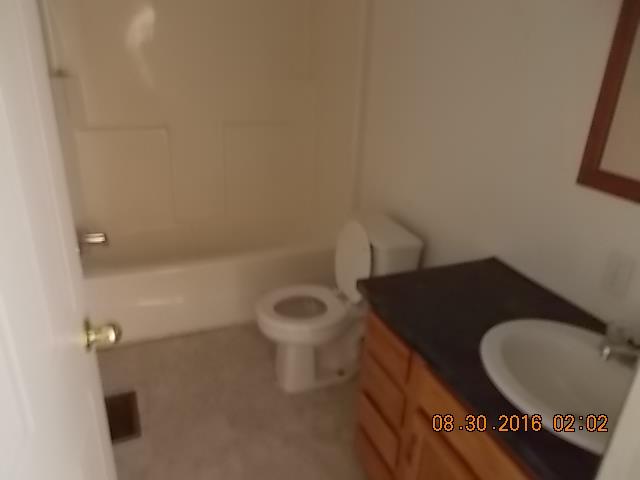 1973 South Commerce Road Watertown, TN 37184 - Photo 8 of 22 a bathroom with a toilet and a sink