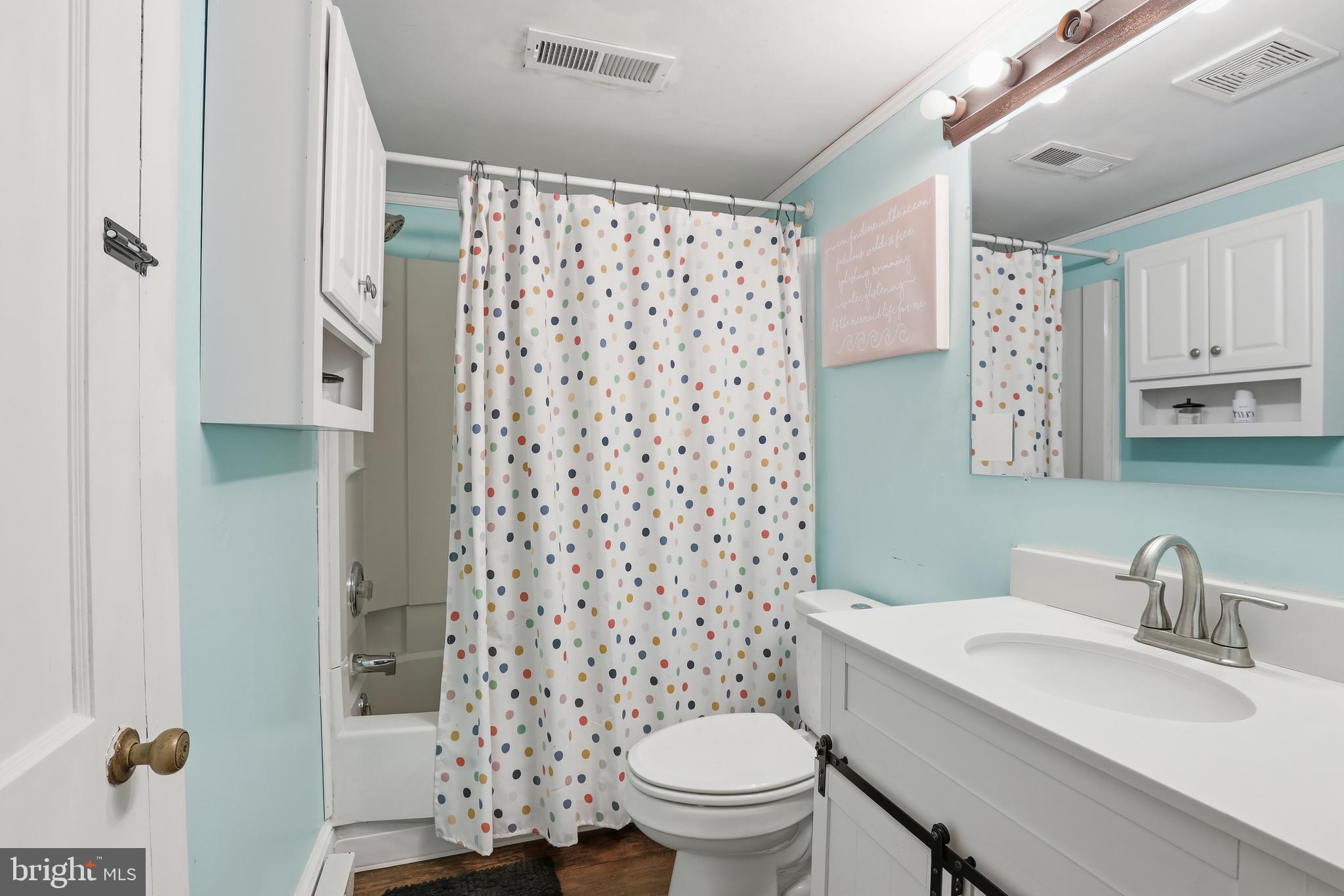 24815 Zoar Road Georgetown, DE 19947 - Photo 19 of 49 a bathroom with a sink toilet and shower