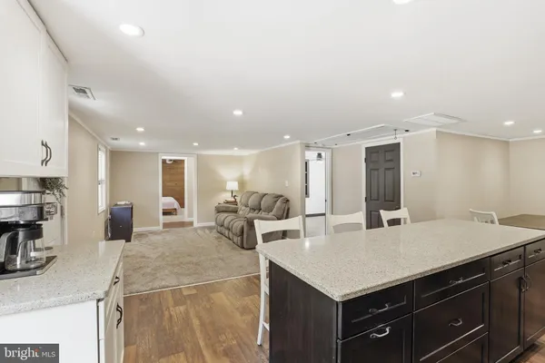 a kitchen with a stove a refrigerator and a sink