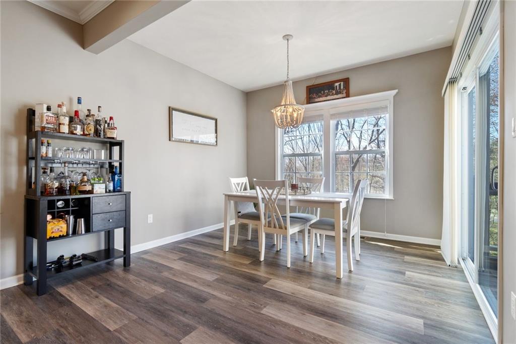 380 Trinity Way Wexford, PA 15090 - Photo 13 of 29 a view of a dining room with furniture and wooden floor