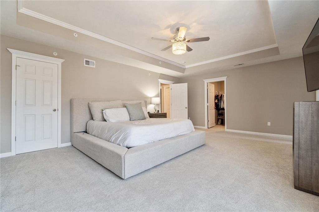 380 Trinity Way Wexford, PA 15090 - Photo 17 of 29 a spacious bedroom with a large bed and ceiling fan
