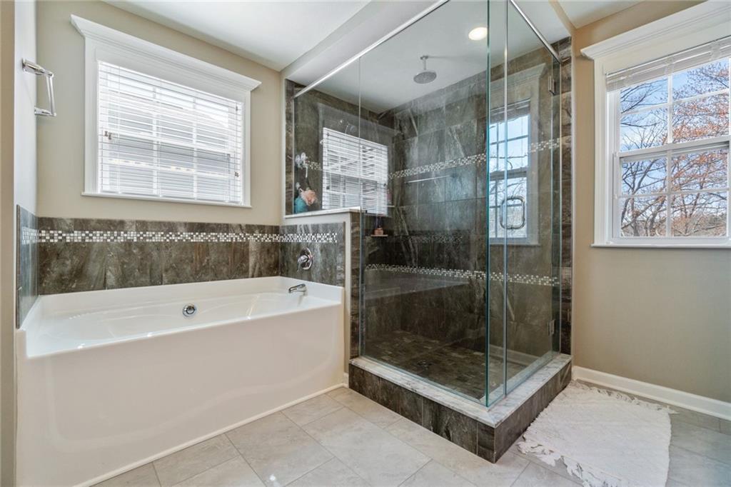 380 Trinity Way Wexford, PA 15090 - Photo 20 of 29 a bathroom with a bathtub and a shower