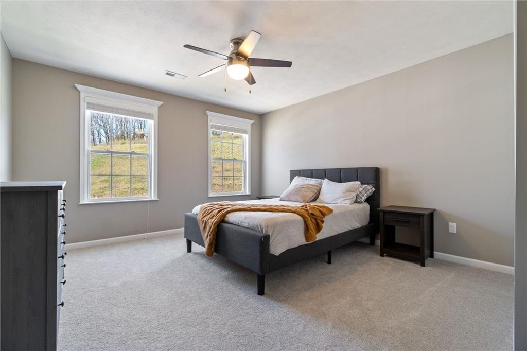 380 Trinity Way Wexford, PA 15090 - Photo 21 of 29 a bed sitting in a bedroom next to a window