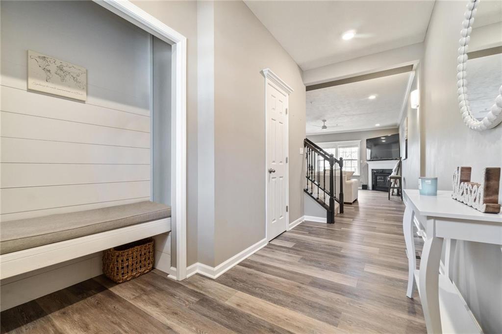 380 Trinity Way Wexford, PA 15090 - Photo 3 of 29 a hallway with wooden floor and chandelier
