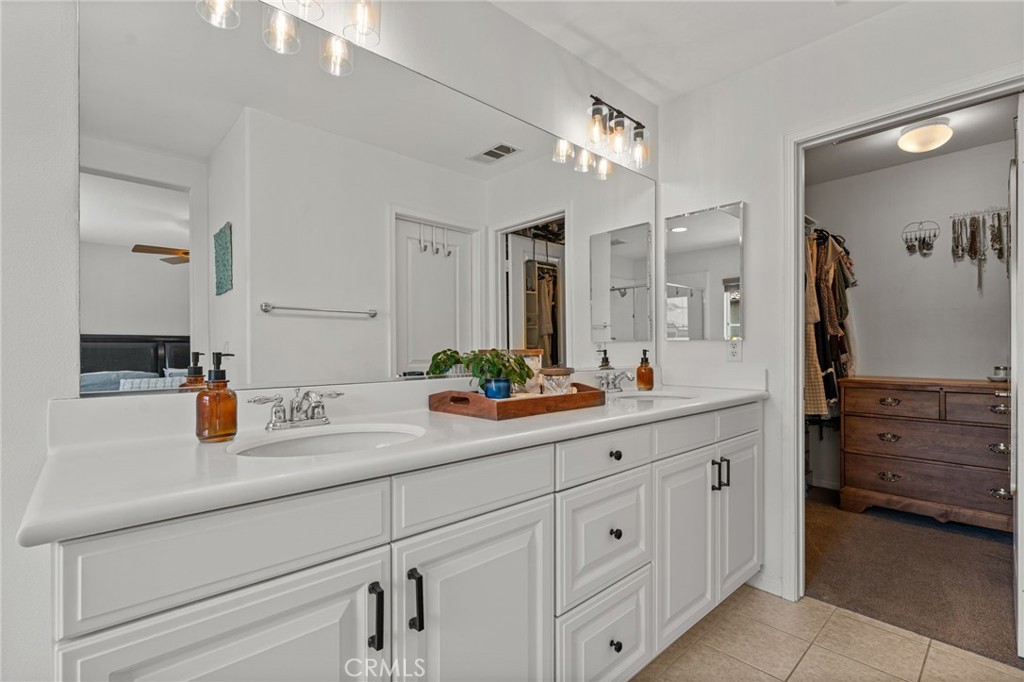 28356 Santa Rosa Lane Saugus, CA 91350 - Photo 13 of 50 a bathroom with double sink and a mirror