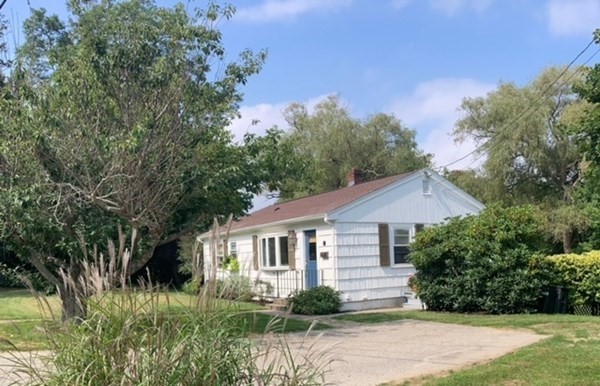 54 Grapevine Road Gloucester, MA 01930 - Photo 2 of 18 a front view of a house with a yard