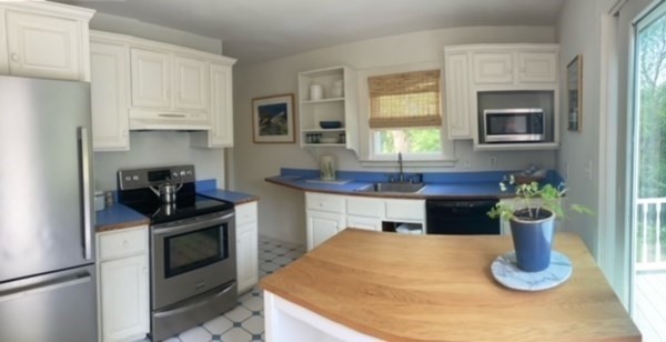 54 Grapevine Road Gloucester, MA 01930 - Photo 5 of 18 a kitchen with a stove and a sink