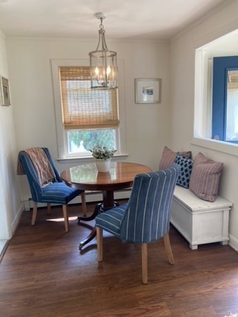 54 Grapevine Road Gloucester, MA 01930 - Photo 10 of 18 a living room with furniture and a chandelier