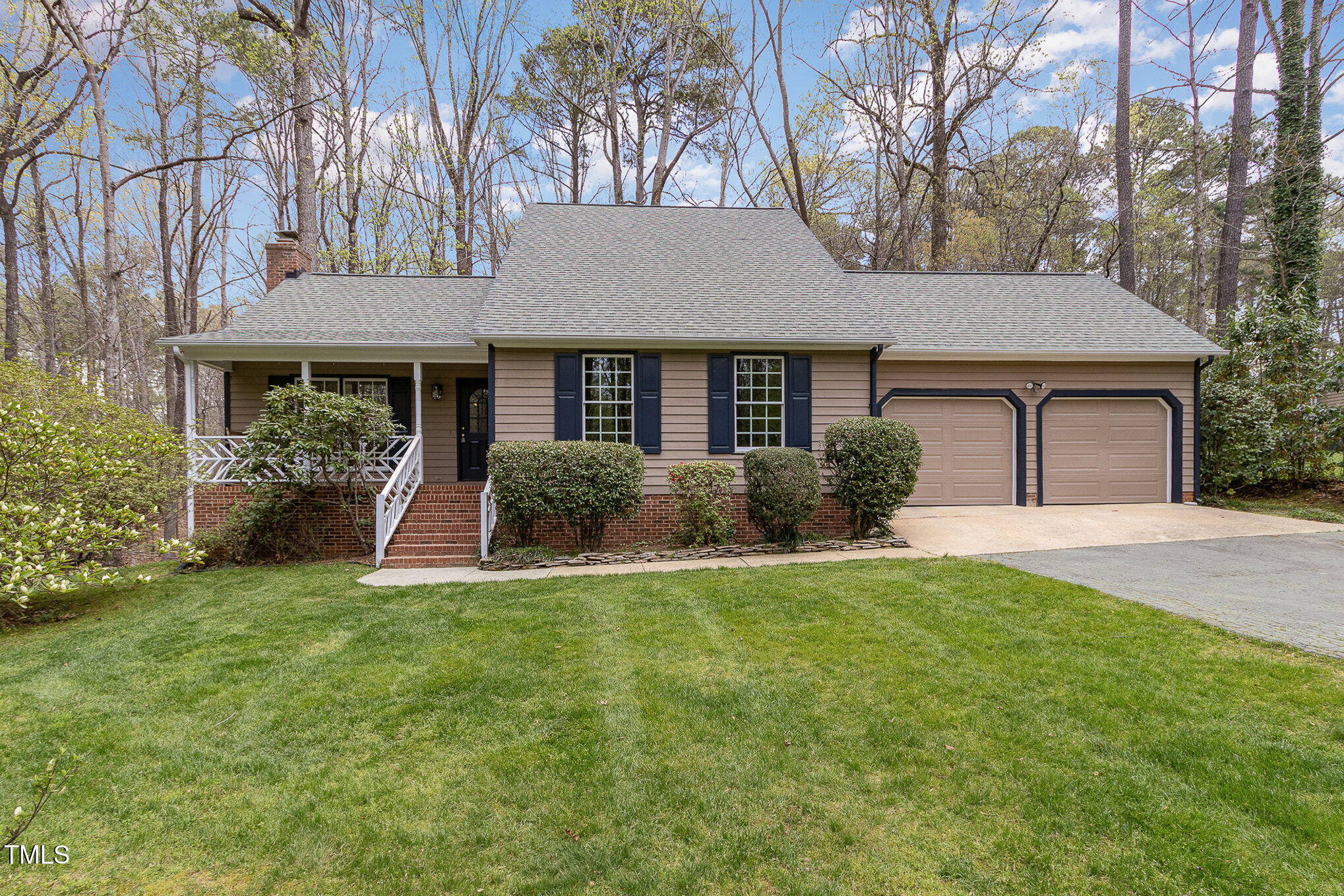 7212 Rabbit Run Wake Forest, NC 27587 - Photo 1 of 32 a view of a house with a yard and potted plants