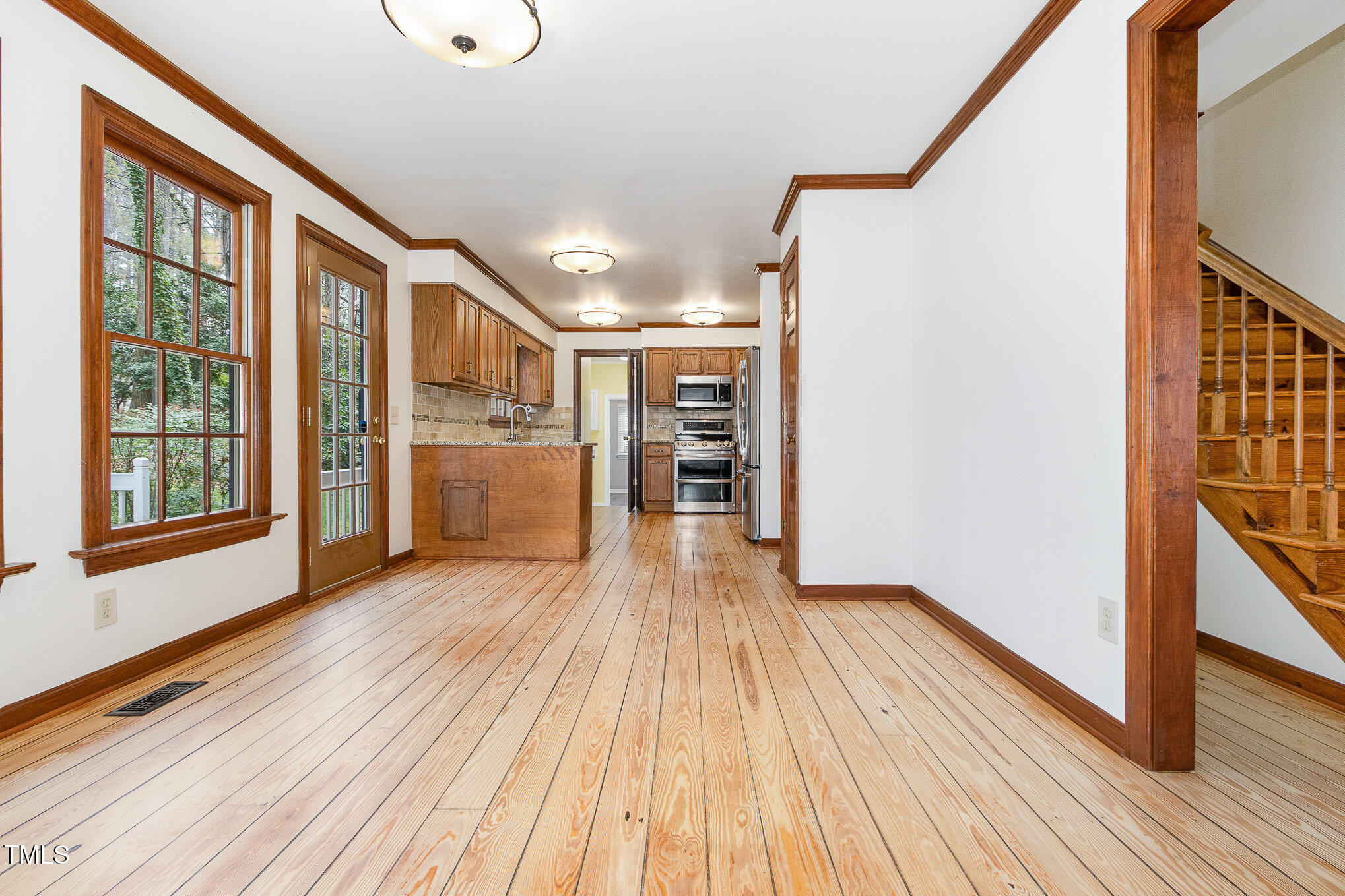 7212 Rabbit Run Wake Forest, NC 27587 - Photo 9 of 32 a view of a house with wooden floor and a window