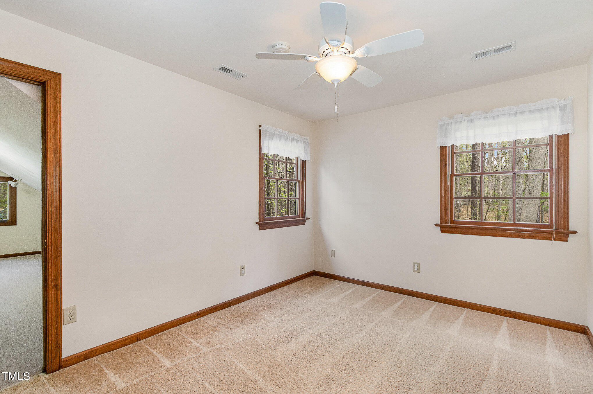 7212 Rabbit Run Wake Forest, NC 27587 - Photo 23 of 32 a view of an empty room with a window
