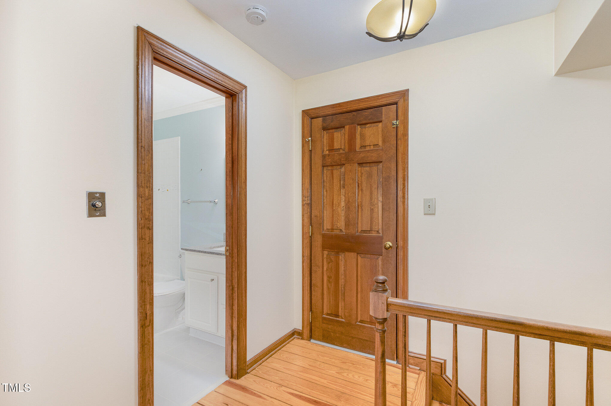 7212 Rabbit Run Wake Forest, NC 27587 - Photo 26 of 32 a view of a hallway with wooden floor