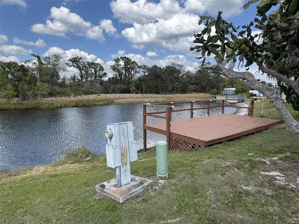 a view of a house with a yard and a pool