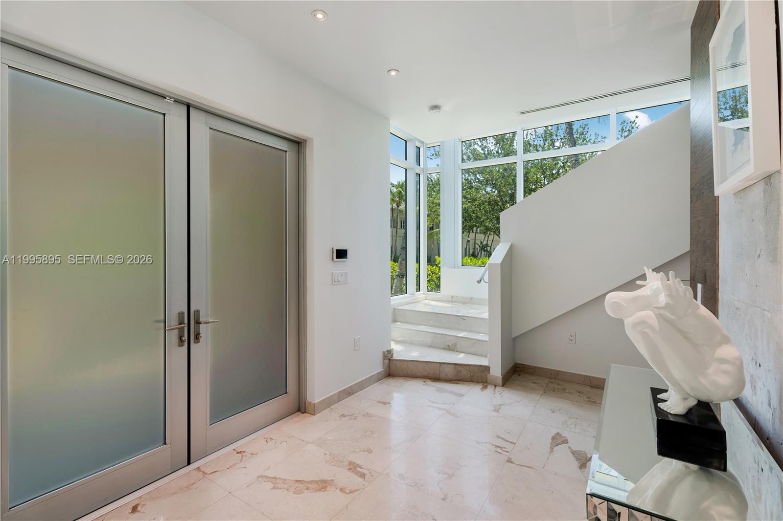 548 Fernwood Road, Unit 548 Key Biscayne, FL 33149 - Photo 13 of 50 a view of entryway with stairs and furniture