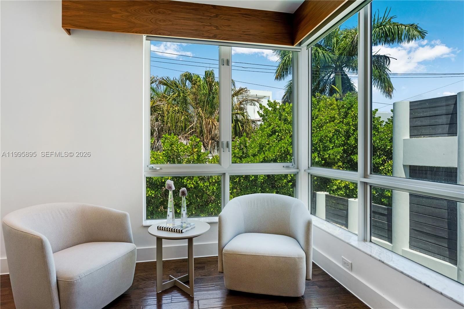548 Fernwood Road, Unit 548 Key Biscayne, FL 33149 - Photo 16 of 50 a balcony with furniture and a potted plant