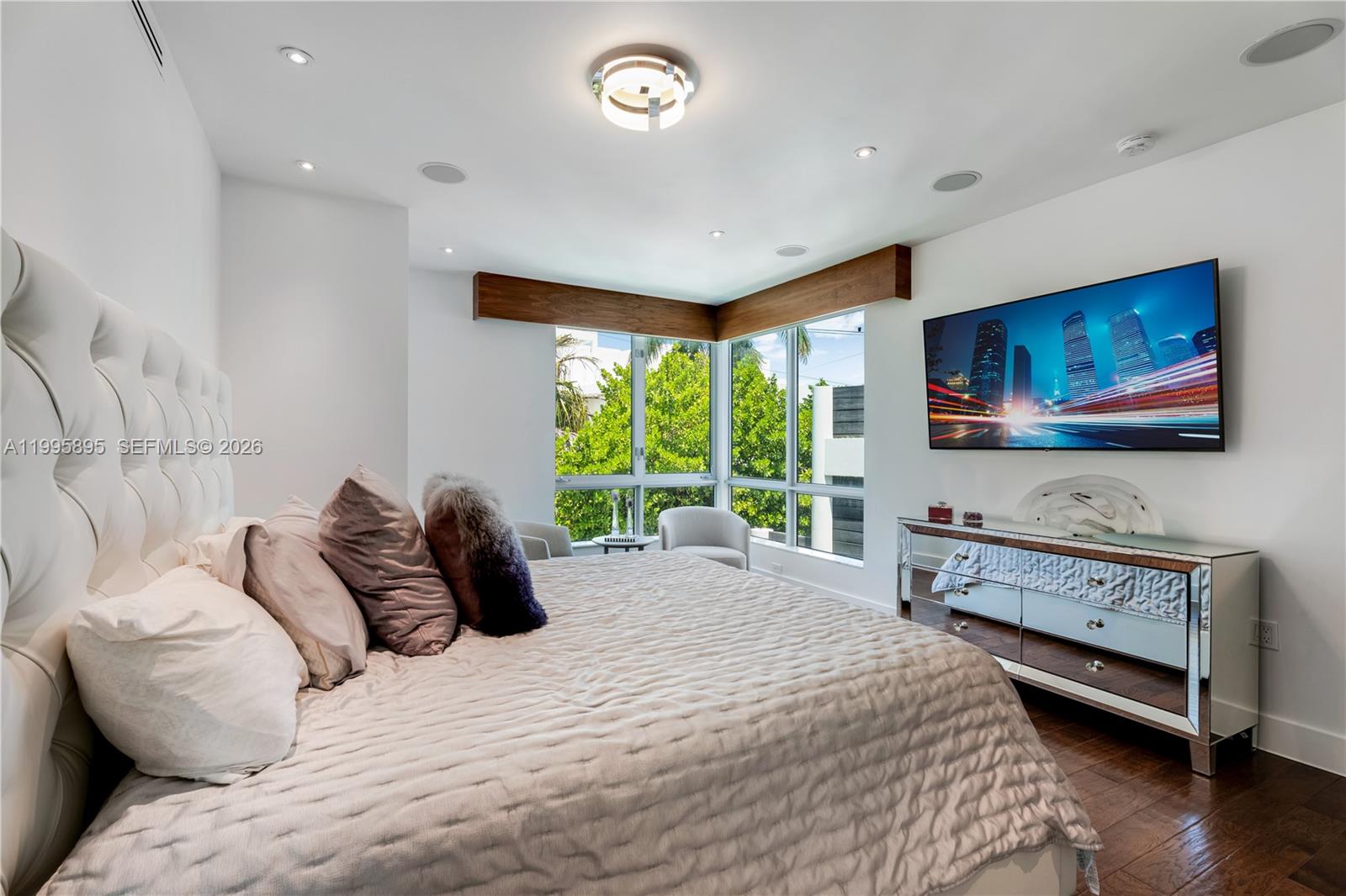 548 Fernwood Road, Unit 548 Key Biscayne, FL 33149 - Photo 17 of 50 a bedroom with a bed and a flat screen tv