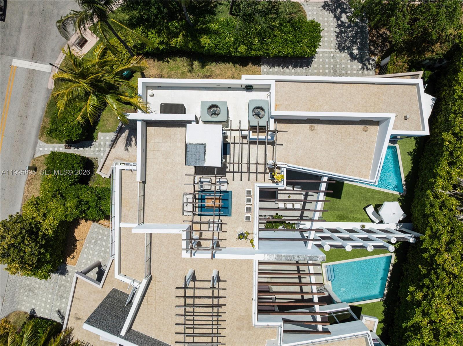 548 Fernwood Road, Unit 548 Key Biscayne, FL 33149 - Photo 44 of 50 an aerial view of a house with a garden